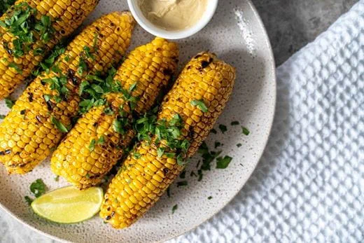 recipe image Smokey Char-Grilled Corn Cobs with Maple Butter